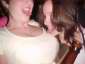 one drunk girl licking her friends tits