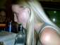 drunk girl sucking on a bottle